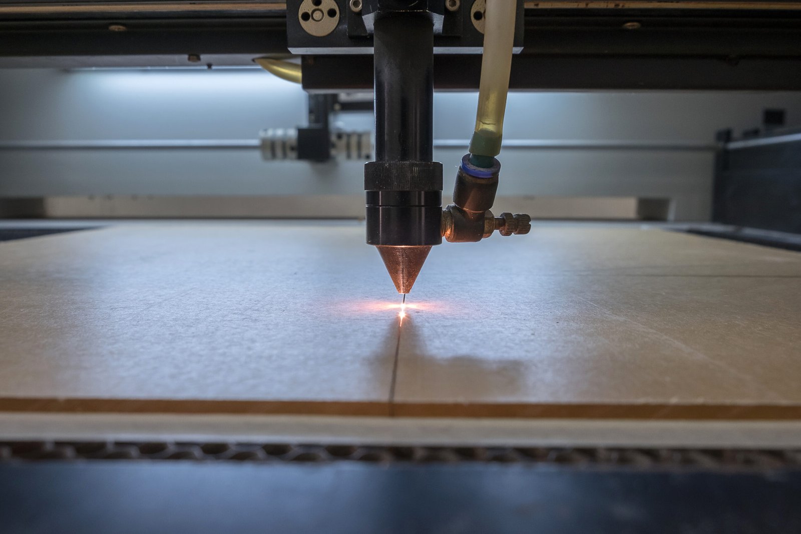 cutting machine carving patterns on the plastic plate